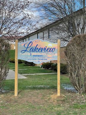 Byesville apartment for rent - A sign for Lakeview Apartments is displayed in front of a building.