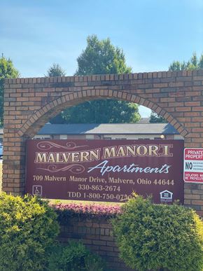 Malvern apartment for rent - A sign for Malvern Manor Apartments is displayed on a brick wall.