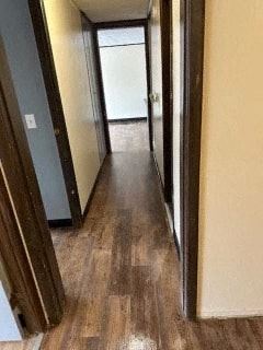 South Charleston apartment for rent - A long hallway with wood floors and a white door at the end.
