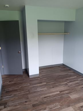 Washingtonville apartment for rent - A room with a grey door and a white cabinet.