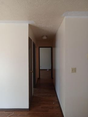 Weston apartment for rent - A long, narrow hallway with a door at the end.