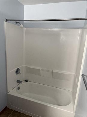 Loudonville apartment for rent - A white bathtub with a shower head and hand held shower.