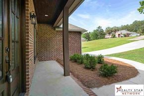 Hattiesburg house for rent - A house entrance with a Realty Star Network logo.