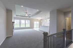 Gretna apartment for rent - A spacious living room with a ceiling fan and sliding glass doors.
