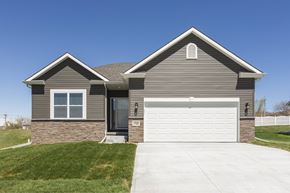 Gretna apartment for rent - A two-story house with a garage door and a driveway.
