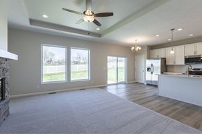 Gretna apartment for rent - A spacious living room with a fireplace and a ceiling fan.