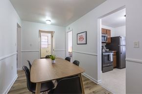 Omaha apartment for rent - A dining room with a table and chairs.