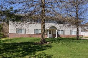 Gretna apartment for rent - A house with a tree in front of it.