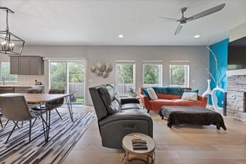 Omaha townhouse for rent - A modern living room with a dining table and chairs.