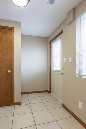 Omaha apartment for rent - A room with a brown door and a white door.