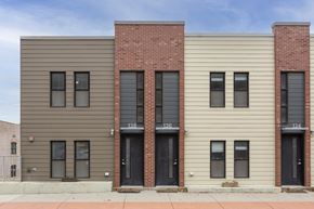 Council Bluffs apartment for rent - A three-story building with a mix of brick and siding exterior.