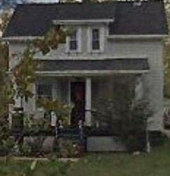 Cleveland house for rent - A house with a red door and a porch.
