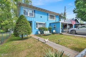 Bristol apartment for rent - A blue house with a white dog in front.