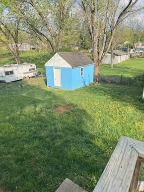 Bristol apartment for rent - A blue shed sits in a grassy yard.