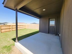 Copperas Cove house for rent - A patio with a door and a fence in the background.