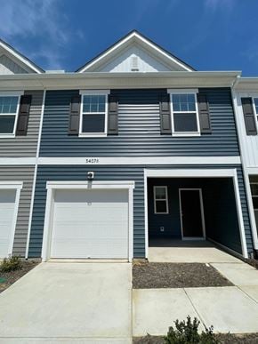 Wilson apartment for rent - A blue house with the number 34073 on the front.