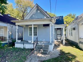 Louisville house for rent - A house with a porch and a covered entrance.