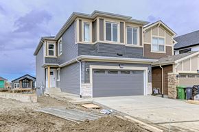 Beaumont apartment for rent - A house under construction with a grey garage door.