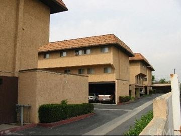 La Puente apartment for rent - A building with a brown facade and a red roof.