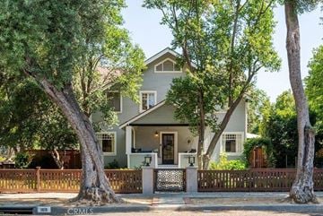 Claremont house for rent - A house with a white fence and a tree in front.