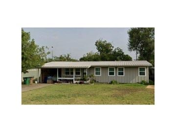 San Angelo house for rent - A house with a grey roof and a green lawn in front.
