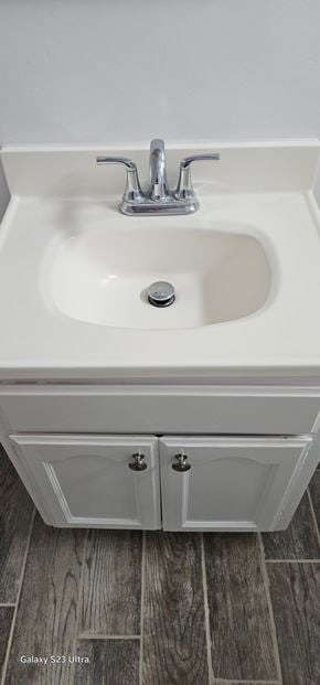 Cudahy apartment for rent - A white sink with a silver faucet and a white cabinet below it.