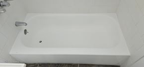 Cudahy apartment for rent - A white bathtub with a faucet and a drain.