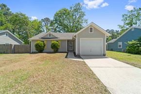 Midway Park house for rent - A house with a garage and a driveway in front of it.