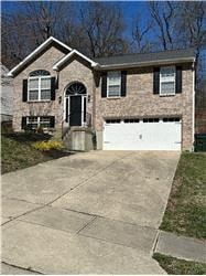Southgate house for rent - A brick house with a black door and a white garage door.