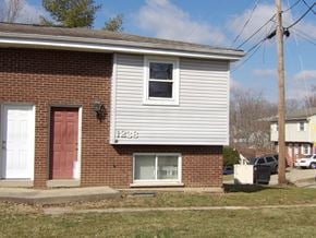 Elsmere house for rent - A house with the number 1258 on the front.