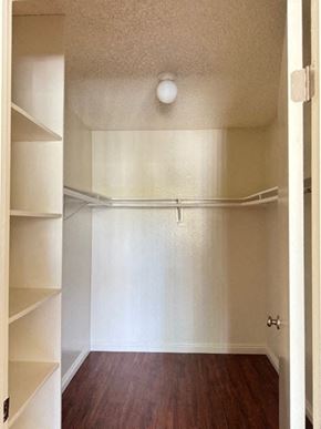 Van Nuys apartment for rent - A white hallway with a light on the ceiling.