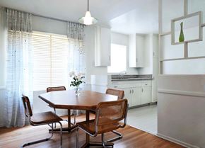 Los Angeles apartment for rent - A dining room with a wooden table and chairs.