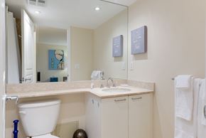 Toronto apartment for rent - A bathroom with a white toilet and a sink.