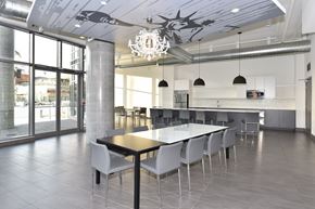 Toronto apartment for rent - A modern dining room with a large table and chairs.