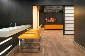 North York apartment for rent - A modern bathroom with a row of yellow chairs and a white sink.