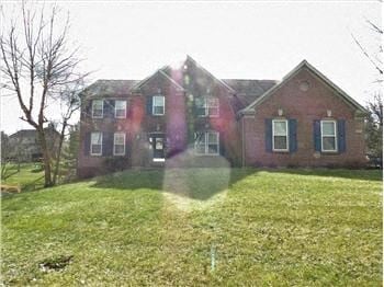 Union house for rent - A red brick house with a green lawn in front.