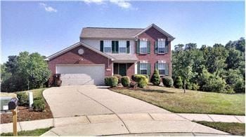 Independence house for rent - A two-story house with a garage and a driveway.
