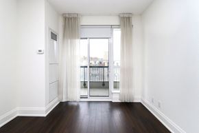 Toronto apartment for rent - A room with a sliding glass door and a window.