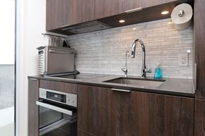 Toronto apartment for rent - A kitchen with a sink and an oven.