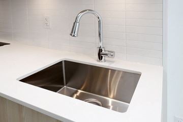 Mississauga apartment for rent - A modern kitchen sink with a chrome faucet.