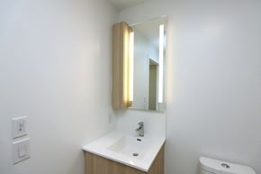 Mississauga apartment for rent - A bathroom with a sink and mirror.