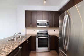 Mississauga apartment for rent - A modern kitchen with a stainless steel refrigerator.