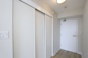 Toronto apartment for rent - A white door is in a room with a light switch on the wall.