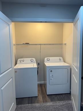 Mccomb apartment for rent - A laundry room with two washing machines.
