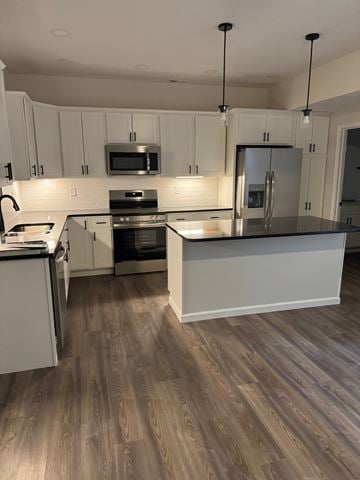 Mccomb apartment for rent - A kitchen with white cabinets and a wooden floor.