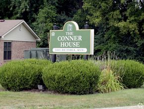 Indianapolis apartment for rent - A green sign that says The Conner House on it.