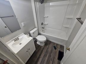 Lima house for rent - A white bathroom with a toilet, sink, and bathtub.