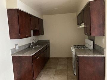 Sun Valley apartment for rent - A kitchen with brown cabinets and a white stove.