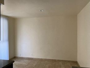 Sun Valley apartment for rent - A room with beige walls and tiled flooring.