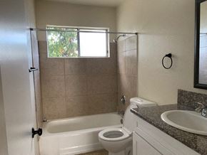 Sun Valley apartment for rent - A bathroom with a toilet, sink, and bathtub.